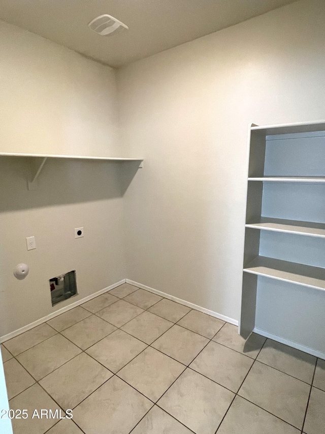 clothes washing area featuring washer hookup, light tile patterned floors, gas dryer hookup, and electric dryer hookup