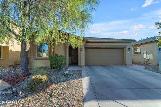44395 W Bailey Dr, Maricopa, AZ 85138 - view of front of home featuring an attached garage, stucco siding, and concrete driveway