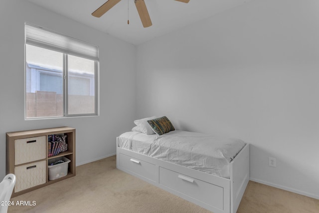 bedroom featuring ceiling fan and light colored carpet