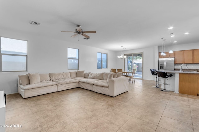 44395 W Bailey Dr, Maricopa, AZ 85138 - living room featuring a chandelier, ceiling fan, light tile patterned flooring, and recessed lighting