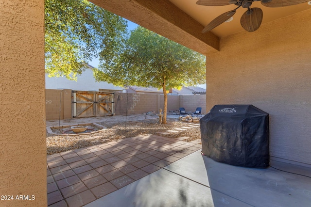 view of patio featuring ceiling fan and grilling area