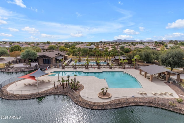 44395 W Bailey Dr, Maricopa, AZ 85138 - community pool featuring a patio area, a mountain view, and a residential view