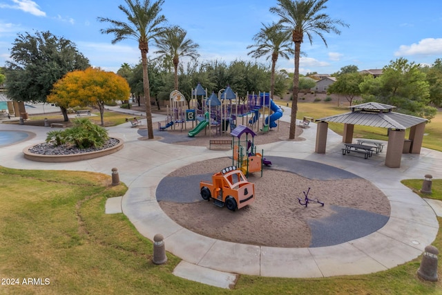 view of jungle gym featuring a lawn