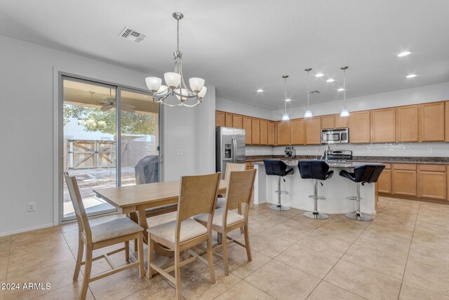 44395 W Bailey Dr, Maricopa, AZ 85138 - dining area featuring a chandelier, light tile patterned flooring, and recessed lighting