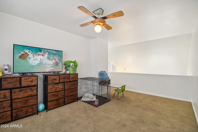 interior space featuring ceiling fan and light colored carpet