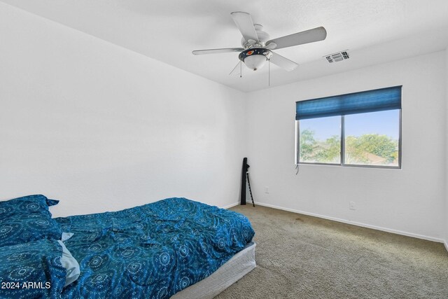 bedroom with ceiling fan and carpet flooring