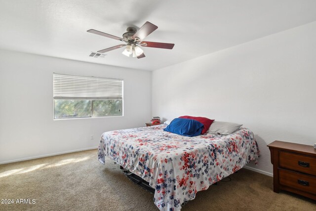 bedroom with ceiling fan and carpet floors