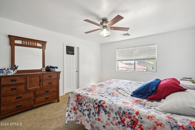 carpeted bedroom featuring ceiling fan