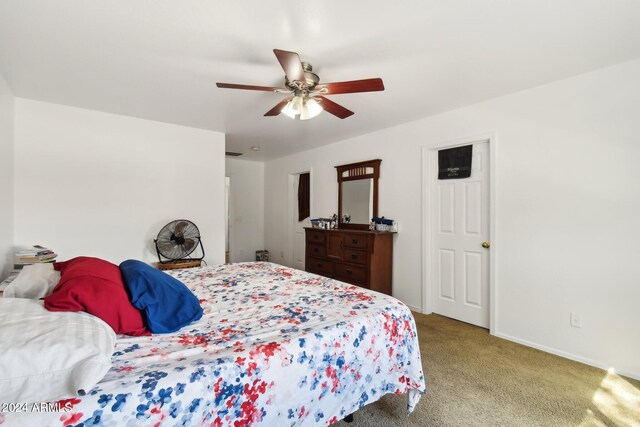 carpeted bedroom with ceiling fan