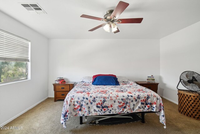 carpeted bedroom featuring ceiling fan