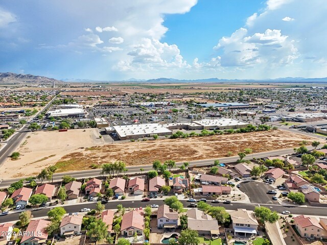 birds eye view of property with a mountain view