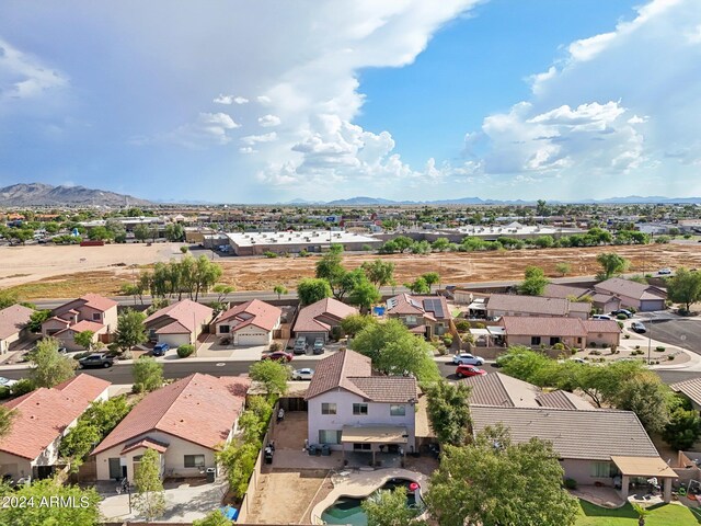 birds eye view of property with a mountain view