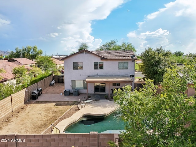 rear view of property featuring a patio, a fenced backyard, central AC, a tile roof, and stucco siding