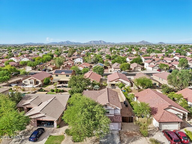 birds eye view of property with a mountain view