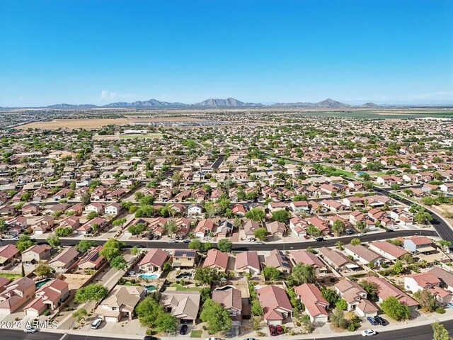 birds eye view of property with a mountain view