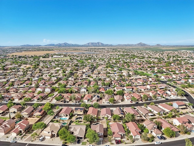 drone / aerial view featuring a residential view and a mountain view