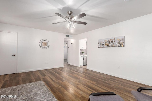 spare room featuring ceiling fan and dark hardwood / wood-style flooring