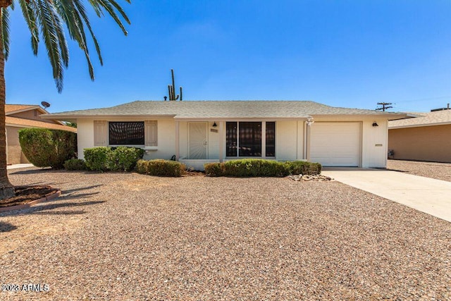 ranch-style home with a garage