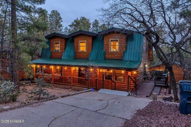 4893 W Big Pine Dr, Lakeside, AZ 85929 - view of front of home with a porch and metal roof