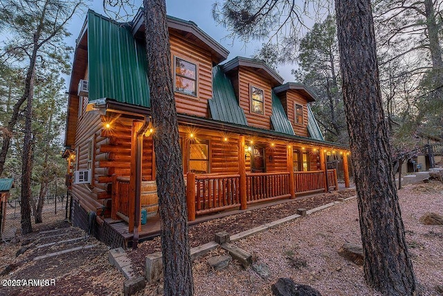 4893 W Big Pine Dr, Lakeside, AZ 85929 - exterior space with a porch, metal roof, fence, and log exterior