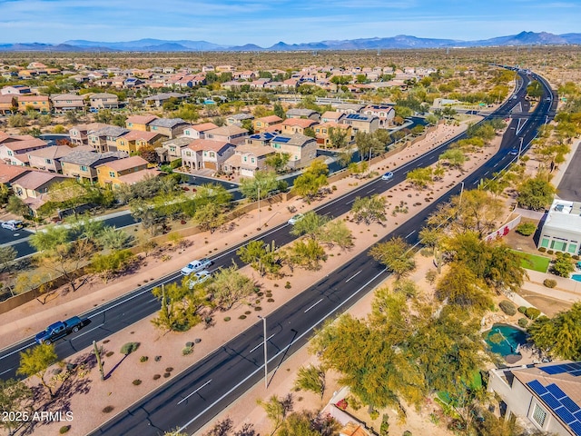 birds eye view of property featuring a mountain view