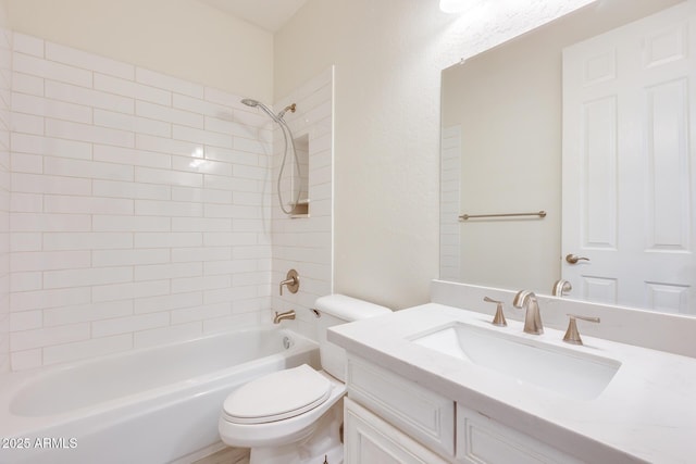 full bathroom featuring vanity, toilet, and tiled shower / bath combo