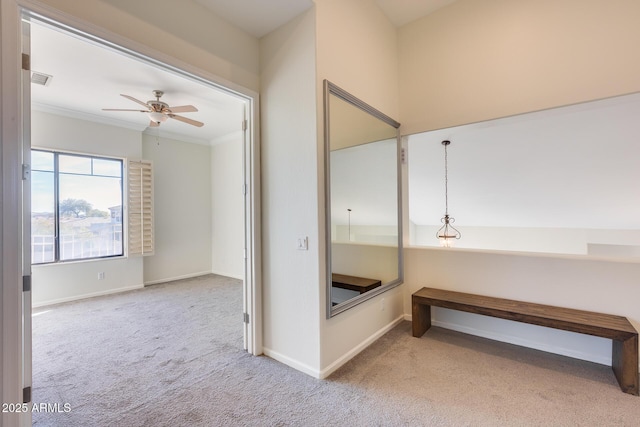 bathroom featuring ornamental molding and ceiling fan