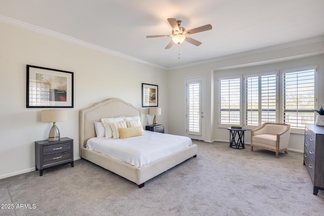 carpeted bedroom featuring ornamental molding and ceiling fan