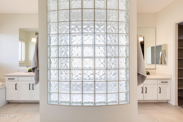 bathroom with tile patterned flooring and vanity