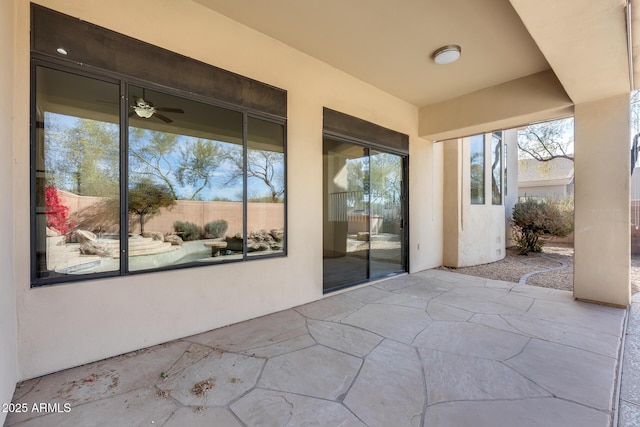 view of patio / terrace featuring ceiling fan