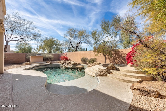 view of pool featuring a patio