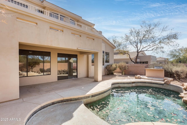 view of pool featuring a patio