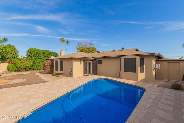 back of property featuring a patio and cooling unit