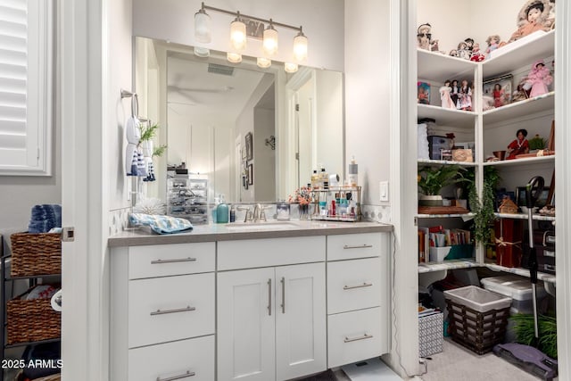 bathroom with visible vents and vanity