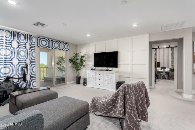 living area featuring light carpet, baseboards, and visible vents