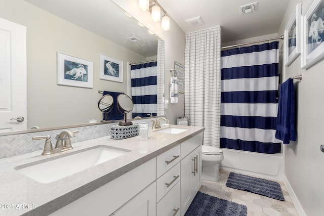 bathroom with tile patterned flooring, visible vents, a sink, and toilet