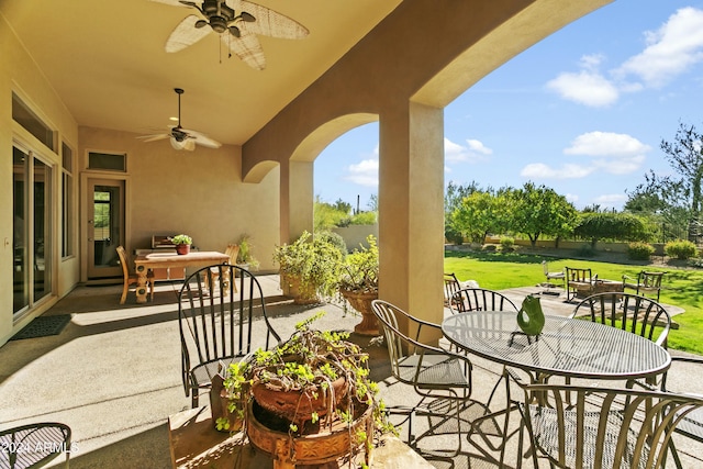 view of patio featuring ceiling fan