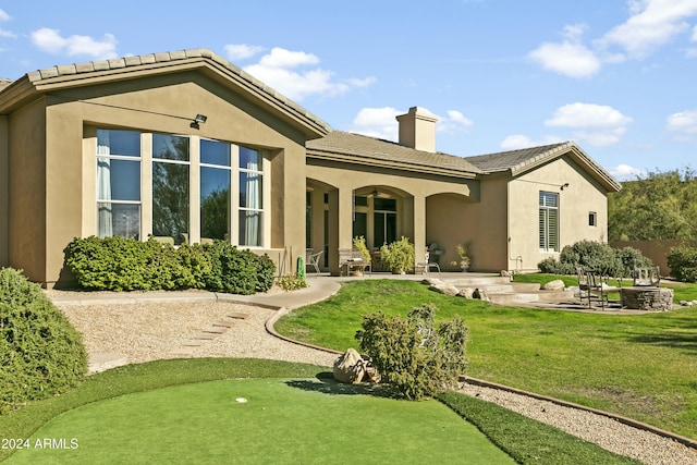 rear view of house featuring a patio area