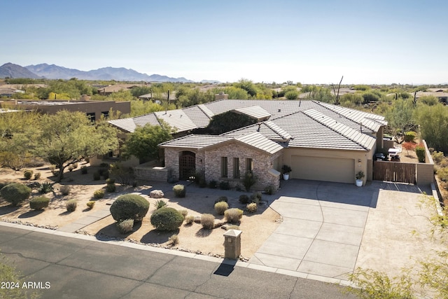 view of front of home featuring a mountain view and a garage