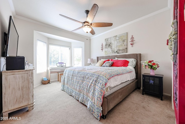 bedroom with baseboards, carpet floors, ceiling fan, and crown molding