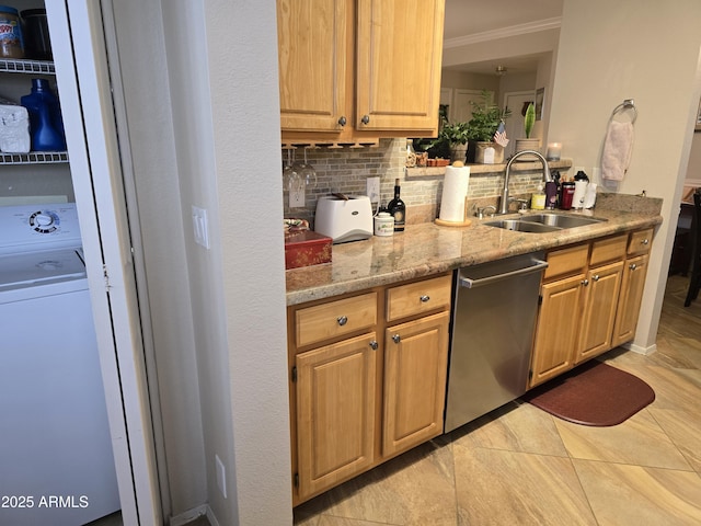 kitchen with sink, light stone countertops, washer / clothes dryer, decorative backsplash, and stainless steel dishwasher