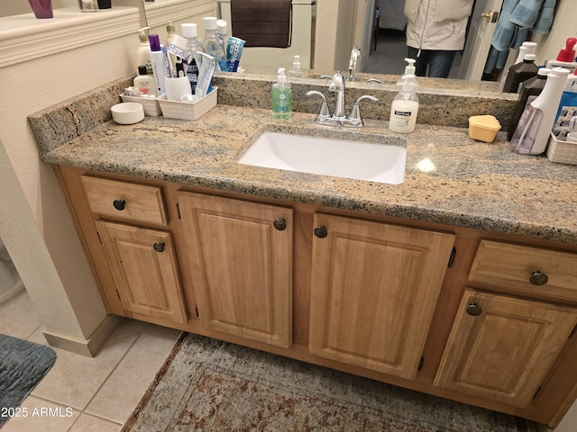 bathroom with vanity and tile patterned floors