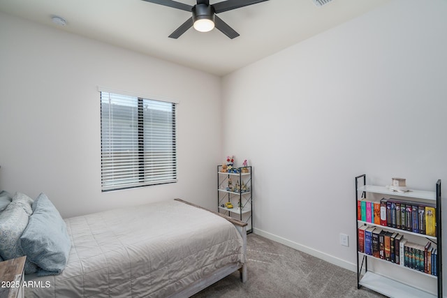 bedroom featuring baseboards, carpet floors, visible vents, and a ceiling fan