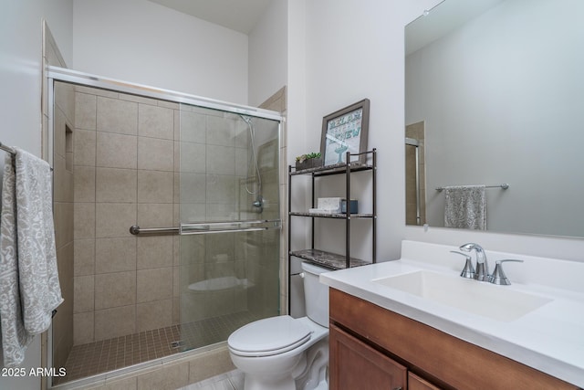 full bathroom with vanity, toilet, and a stall shower