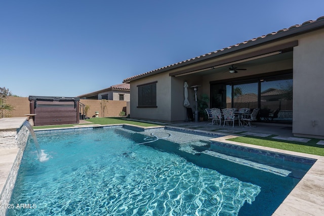 view of swimming pool featuring a patio, fence, a fenced in pool, and ceiling fan