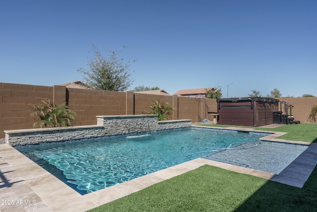 view of swimming pool featuring a jacuzzi, a fenced in pool, and a fenced backyard