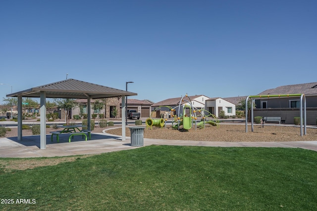 communal playground with a gazebo, a lawn, and a residential view