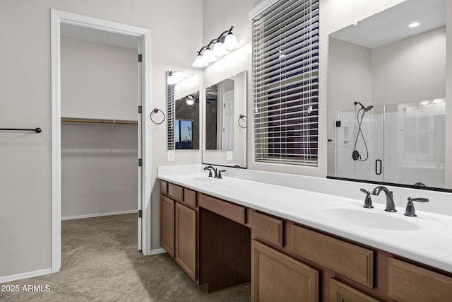 bathroom featuring vanity and a shower with door