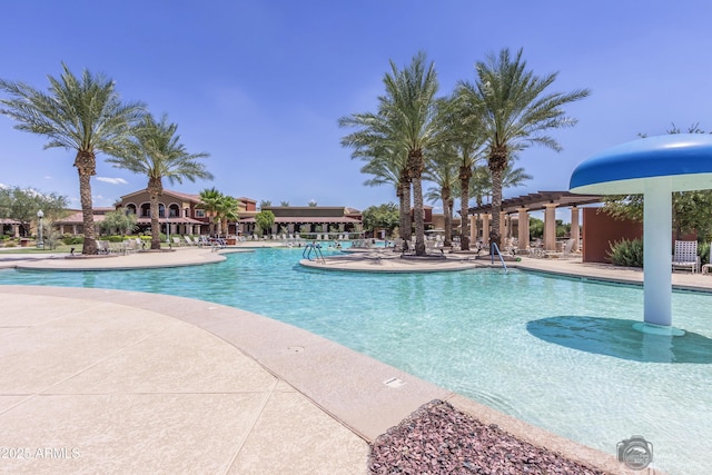 pool featuring a patio and a pergola