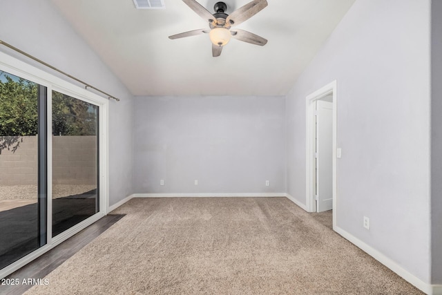 spare room with a ceiling fan, baseboards, visible vents, and lofted ceiling